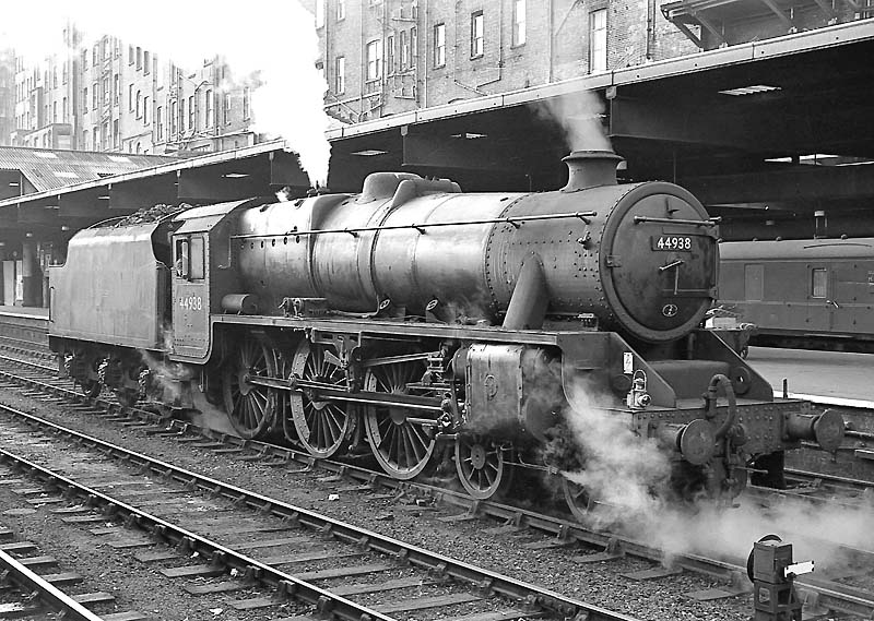 Ex-LMS 5MT 4-6-0 No 44938 stands on one of the centre roads between platforms 3 and 4 on 14th September 1962