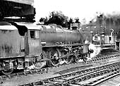 Ex-LMS 5MT 4-6-0 No 44906 is seen departing from platform 3 with an up express on 29th June 1963