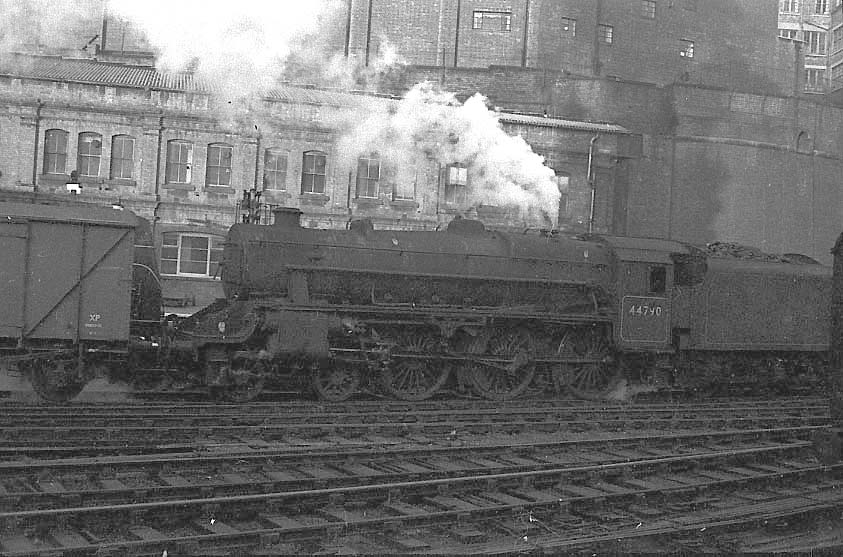 British Railways built 5MT 4-6-0 No 44740 is seen running tender first through New Street station with an up freight service in 1958