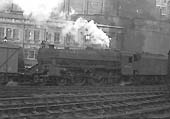 BR built 5MT 4-6-0 No 44740 is seen running tender first through New Street station with an up freight service