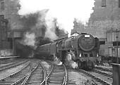 British Railways Standard Class 7MT 4-6-2 No 70047 arrives at the head of a down express on 13th July 1963