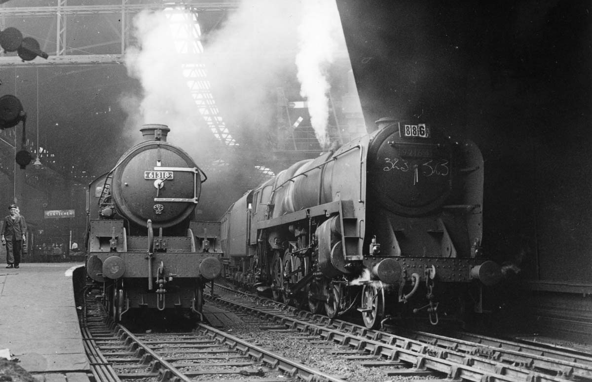 Ex-LNER B1 Class 4-6-0 No 61318 and British Railways Standard Class 9 2-10-0 No 92164 stand together under the lee of Queens Drive bridge