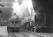 Ex-LNER B1 Class 4-6-0 No 61318 and British Railways Standard Class 9 2-10-0 No 92164 stand together under the lee of Queens Drive bridge