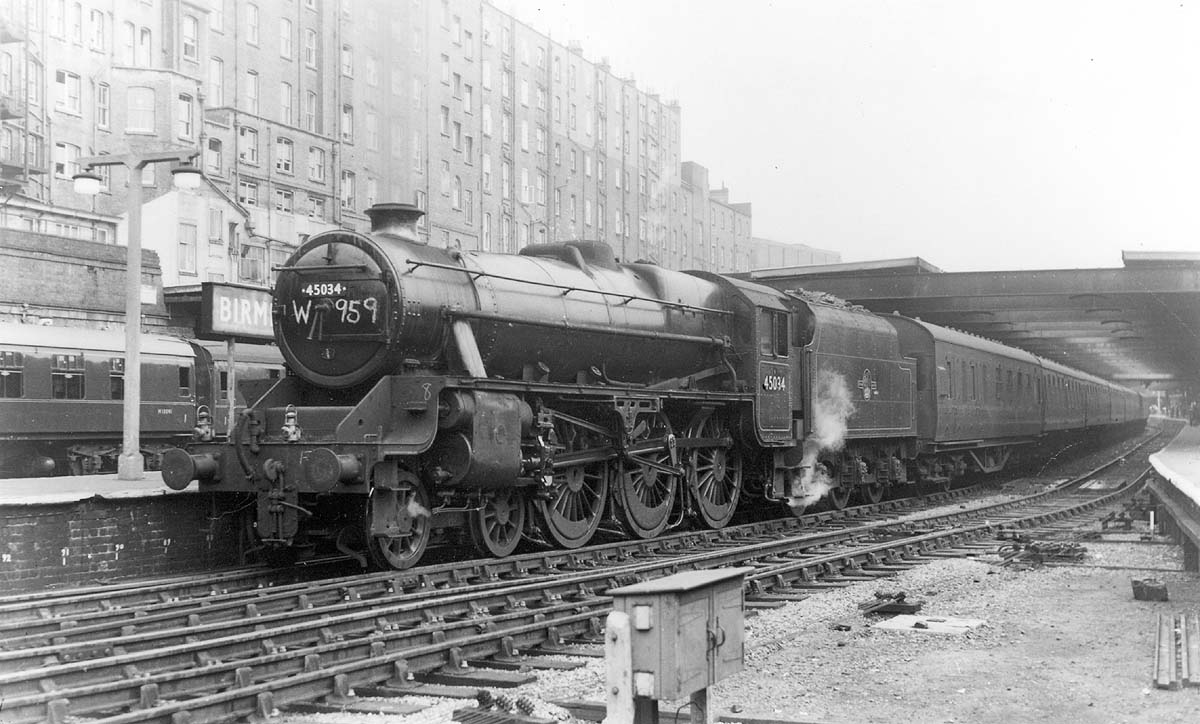 Ex-LMS 4-6-0 5MT 4-6-0 No 45034, one of Stanier's ubiquitous 'Black 5s' is seen standing at the West end of Platform 5 with a northbound express