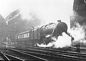 Ex-LMS 5MT 4-6-0 No 44964 is seen wreathed in steam on a very wet cold Spring day leaving the West end of Platform 9 at the head of the 12 42pm Pines Express