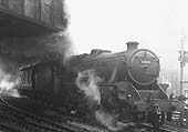 Ex-LMS 5MT 4-6-0 No 44942 is seen leaving Platform 6 with steam leaking from the steam heating pipe as it heads the 12 10pm express to Manchester