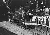 Preserved Midland Railway 4P 4-4-0 Compound No 1000 is seen standing standing at the East end of Platform 7 with scores of enthusiasts in attendance