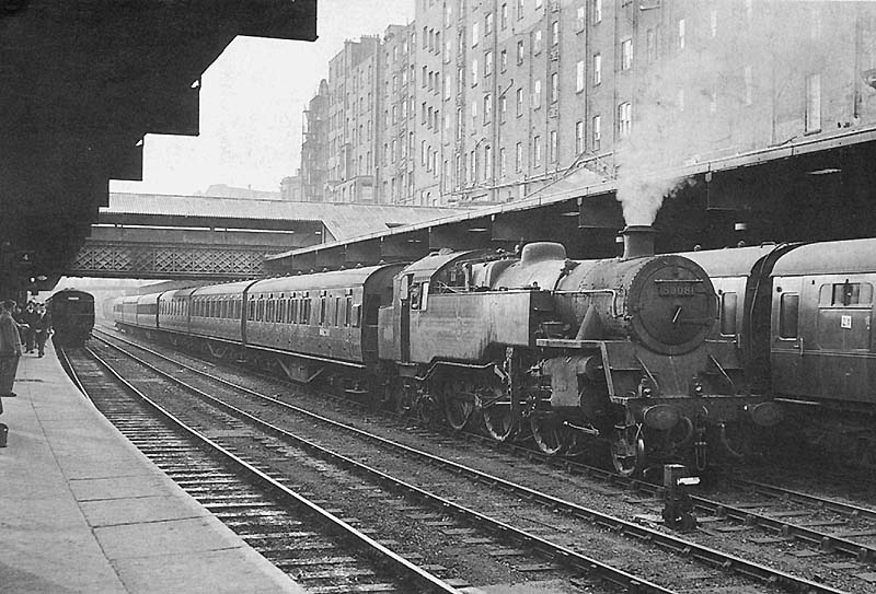 British Railways Standard Class 4MT 2-6-4T No 80081 is seen on the up middle road between Platforms 3 and 4 with empty stock for the 5 49pm service to Rugby