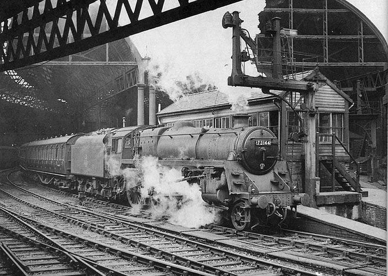 British Railways Standard Class 5 4-6-0 No 73144 is seen standing at the East end of Platform 9 adjacent to Signal Box No 2 at the head of an up express