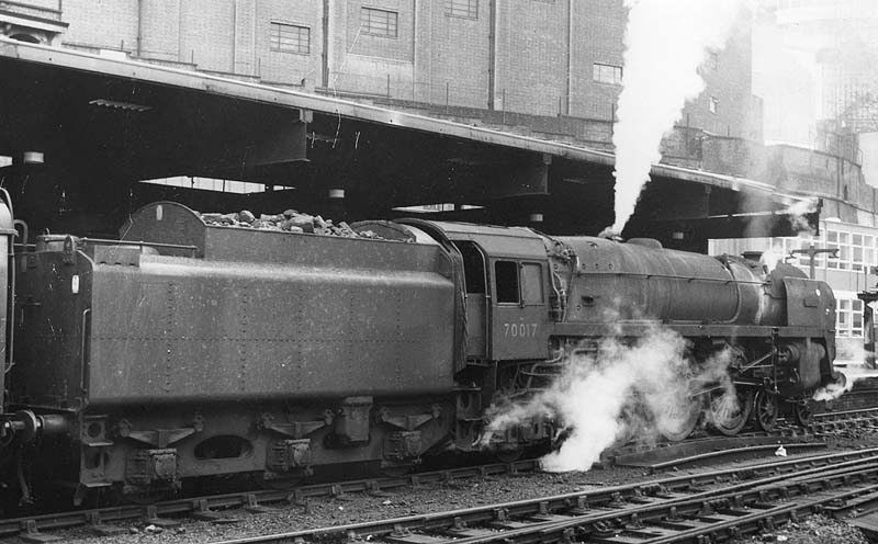 British Railways Standard Class 7 4-6-2 No 70017 'Arrow', a Britannia class locomotive, stands at the East end of Platform 5 with an up express