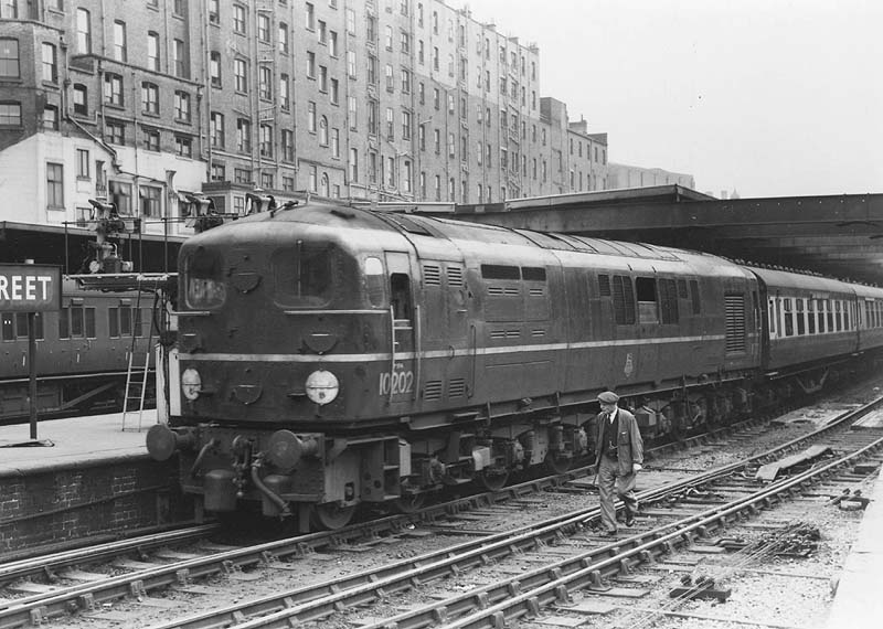 Ex-Southern Diesel No 10202, the second locomotive of this experimental locomotive class, is seen standing at Platform 5 on a down express