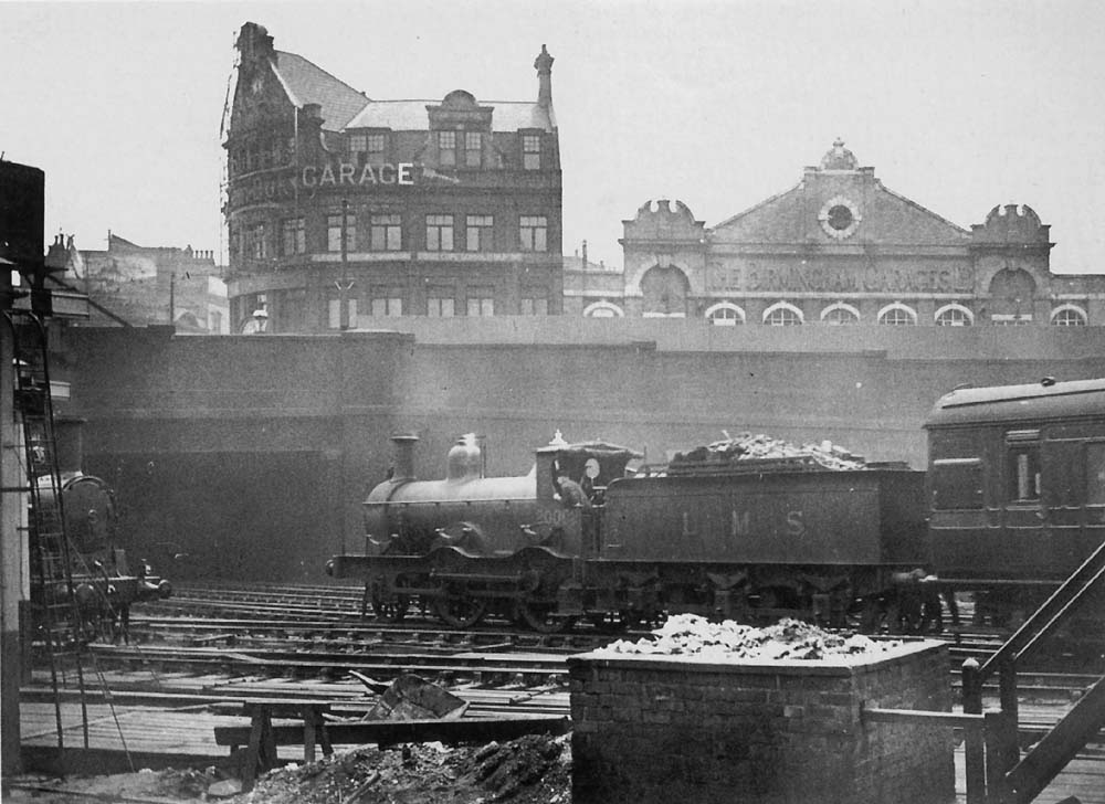 Midland Railway 1P 2-4-0 No 20002 is seen approaching the Midland portion of New Street station at the head of a local passenger service from Kings Norton