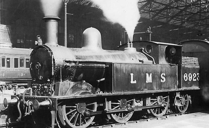 Ex-LNWR 0-6-2T 'Watford Tank' No 6923 is seen standing at the West end of Platform 2 at the head of a Wolverhampton local passenger train