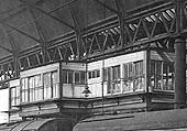 Close up showing New Street Signal Cabin No 4 located beneath the roof and above Platform 9