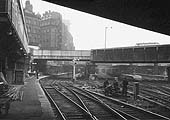 Looking East from beneath Hill Street bridge along Platform 1 with the Queen's Hotel towering above the station on 2nd April 1964