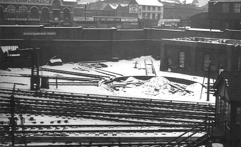 An elevated view of the snow covered disused and dismantled turntable situated opposite New Street No 5 Signal Cabin with the remains of the tank house behind