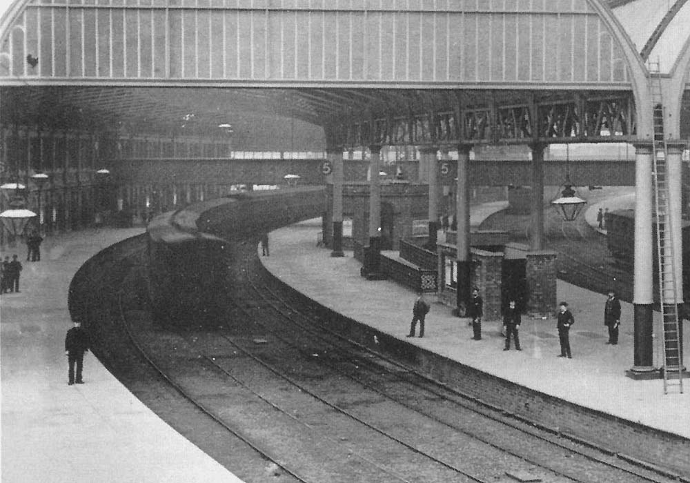 Close up showing both Platform 6 on the left and Platform 5 with a rake of Midland Railway coaching stock standing on the central storage road