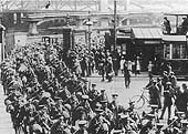 Soldiers of the Great War march out of Queens Drive and cross over Hill Street and into John Bright Street