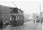 Looking along Hill Street towards the junction with Navigation Street whilst on the right beyond the tram stop is the entrance to Queens Drive