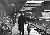 Looking East along Platform One in November 1965 whilst opposite Platform Three the erection of the new station continues apace