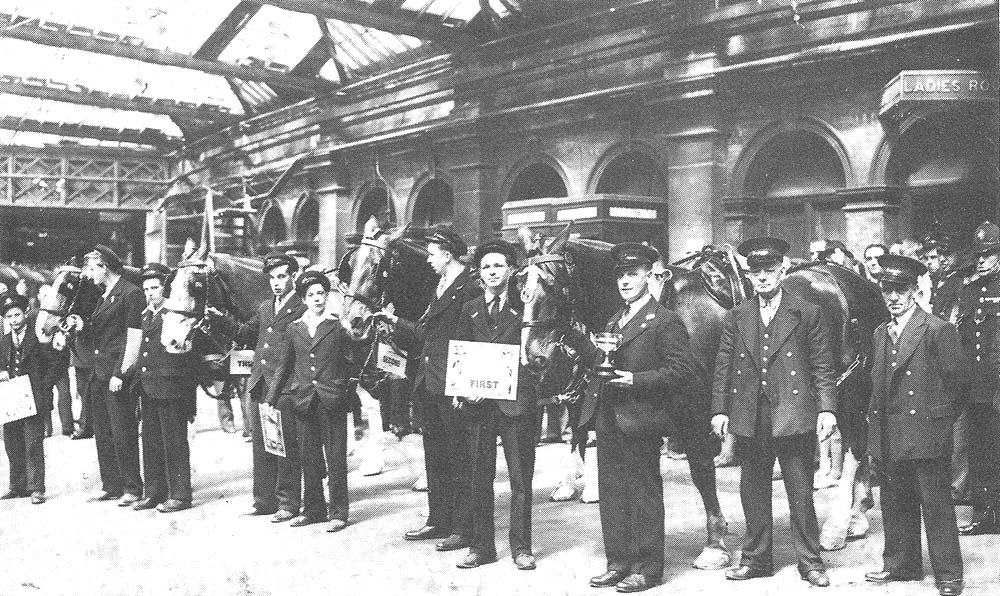 Prize winning van horses and their drivers from the LMS pose for the camera in Station Street cab rank in 1936