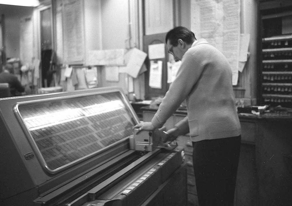 View of a clerk using one of the new 'glider' ticket machines to issue tickets at New Street station
