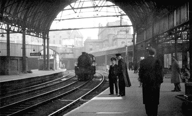Looking along Platform 10, originally Platform 6, towards New Street No 2 Signal Box and Queens Drive bridge whilst an unknown ex-LMS 4-6-0 stands on the centre road