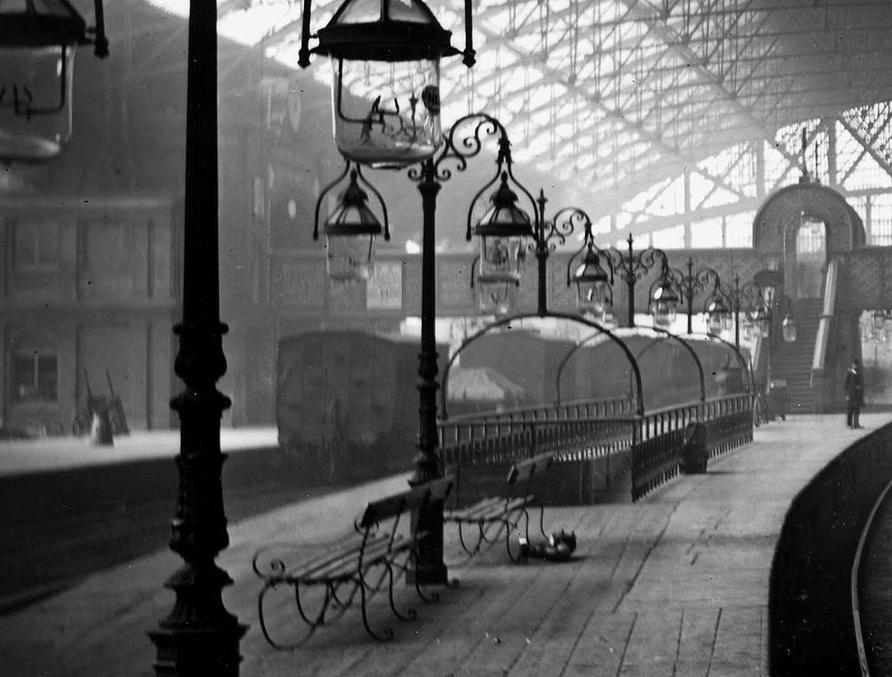 Close up of platform 2 showing the row of ornate cast-iron pairs of lamps which was the LNWR's method of providing light  New Street station