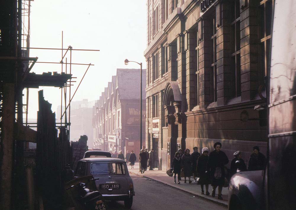 View south down Worcester Street from New Street in 1963 including the row of shops at the station’s east end
