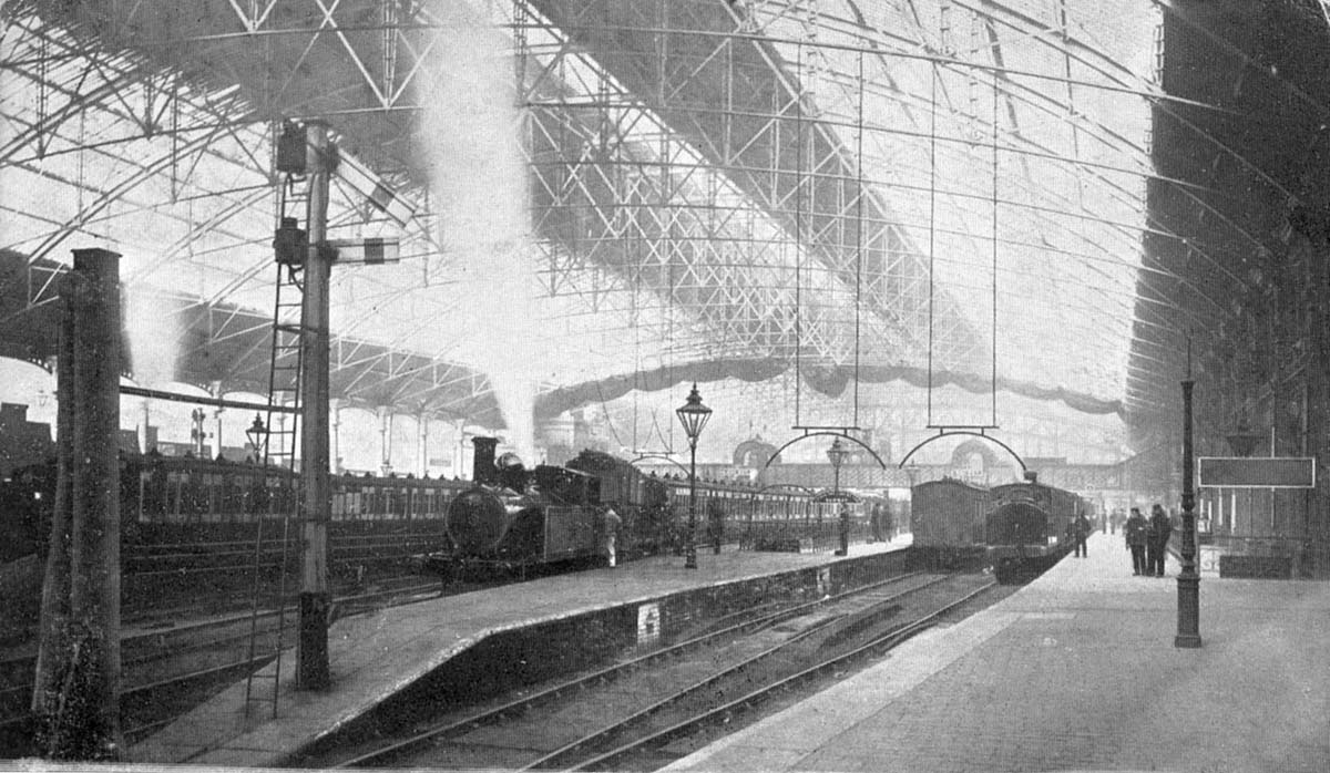 An Edwardian view looking along the bay platform serving the South Staffordshire services with the Queen's Hotel on the right
