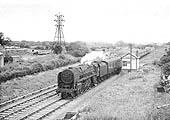 British Railways Standard 7MT 4-6-2 No 70047 passes by Bilton Sidings signal cabin on 26th June 1960