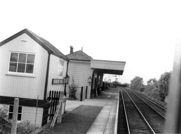 View of the LNWR's Braunston station with the platform and station building and signal box on the left and the passing loop on the right