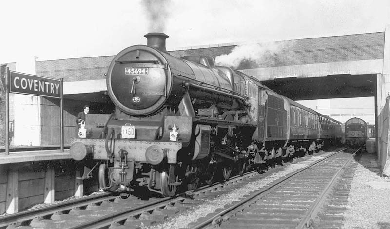 Ex-LMS 4-6-0 Jubilee class 5XP No 45694 'Bellerophon' is seen standing at Coventry station's new platform three