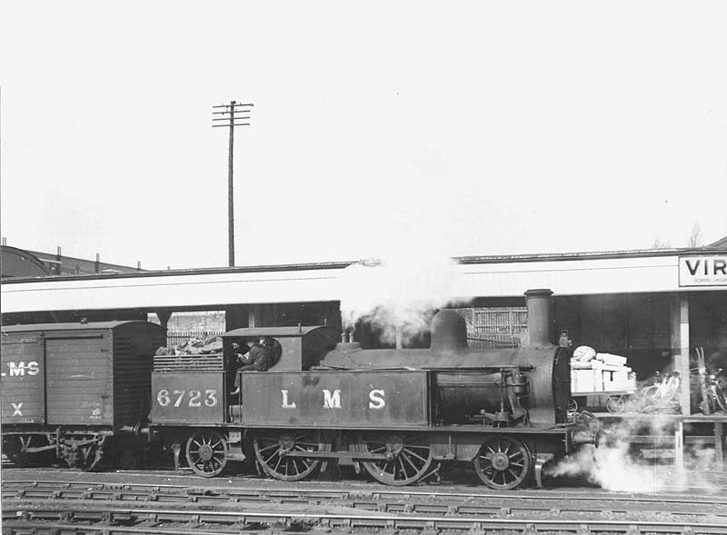 Ex-LNWR 2-4-2T Precursor tank class No 6723 is seen with safety valves lifting as it pauses between shunting duties in the parcels bay