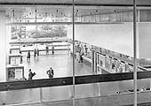 An elevated view of the interior of Coventry station's new booking hall and passenger concourse six months after opening