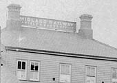 Close up showing the Midland Railway's sign between the two chimneys advertising their Parcels and Goods Office