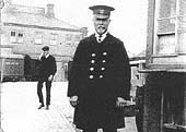Mr John James King, Chief Cartage Foreman, with the Midland Railway shed and offices in the background