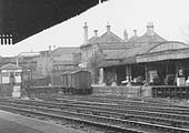 Close up showing Coventry station's parcel dock and platform buildings with two Vent vans standing at the platform