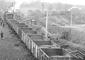 View of two unidentified ex-LMS 2-8-0 8F locomotives being employed during electrification and track renewal operations at Humber Road junction