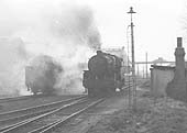 Two unknown ex-LMS locomotives, wreathed in smoke, stand at the entrance to Gosford Green goods yard