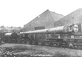 An unidentified 0-4-0ST is seen moving a large naval gun through Coventry Ordance Works to be moved to Scotoun in Glasgow where it would be married to its mountings