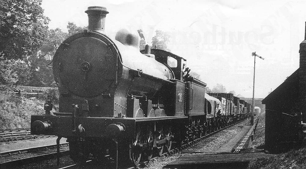 A LNWR 0-8-0 G1 class goods locomotive is seen at the head of an up local goods train as it approaches Hampton formerly 'Derby Junction' station