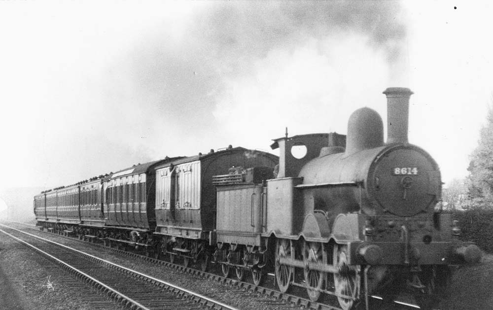 Ex-LNWR 2F 0-6-0 Cauliflower No 8613 is seen on a local passenger service near Hampton in Arden in April 1927