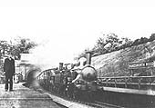 Two LNWR locomotives storm out of the tunnel whilst at the head of an up train to Birmingham New Street