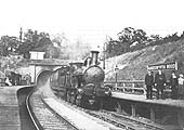 An unidentified LNWR 2-4-0 'Jumbo' locomotive heads a train out of the tunnel and en-route to New Street
