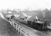 LNWR No 683 is seen passing through the station with an up goods train most likely destined for Wolverhampton