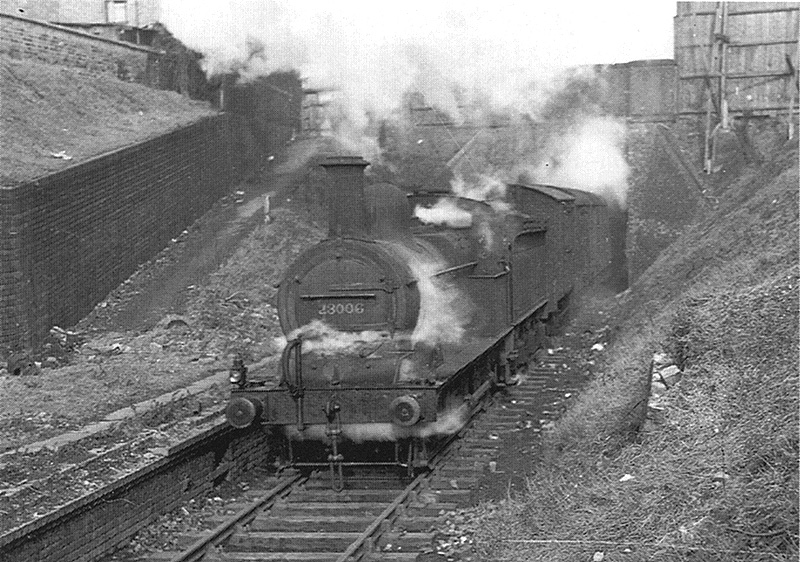 LMS 0-6-0 No 21006 emerges from beneath Icknield Port Road bridge with a goods train for Hagley Road and Harborne stations in 1949