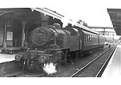 British Railways built Ivatt 2MT 2-6-2T No 41228 is seen standing at platform one at the tail end of a two-coach motor fitted local train to Weeden