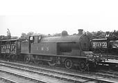 Ex-LNWR 2P 'Precursor Tank' No 6826 is standing at platform two at the head of a goods train with a cattle wagon immediately behind the bunker