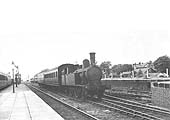 Ex-LNWR 1P 2-4-2T No 6609, a Webb 5ft 6in tank locomotive, is seen arriving at Leamington Avenue station at the head of a two-coach motor train